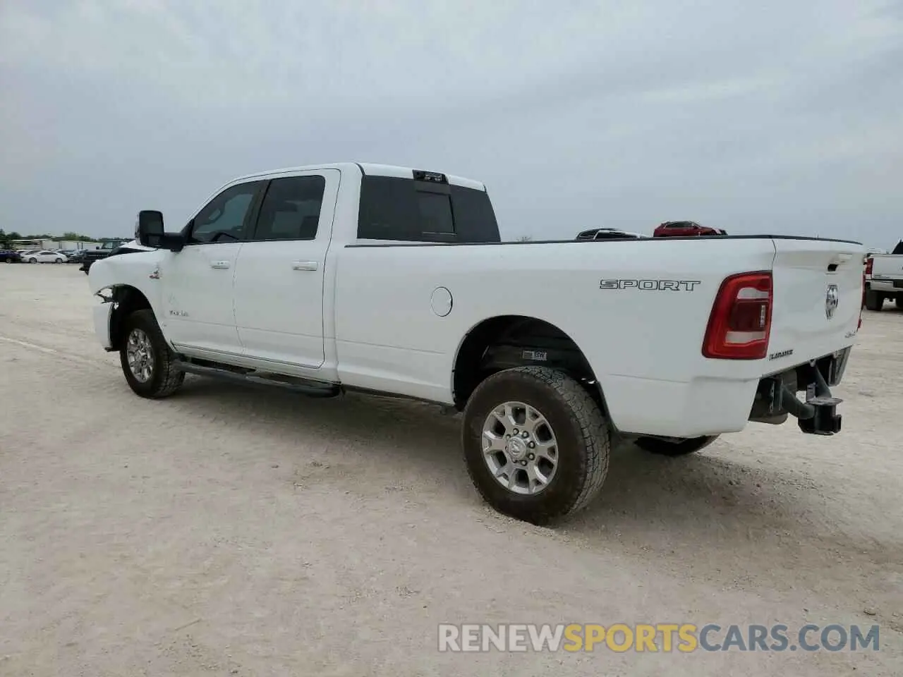 2 fotografías del automóvil dañado 3C6UR5KL4PG549631 RAM 2500 2023