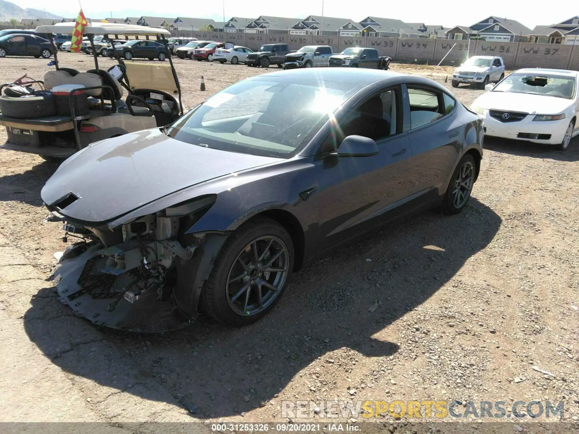 2 fotografías del automóvil dañado 5YJ3E1EA2MF940085 TESLA MODEL 3 2021