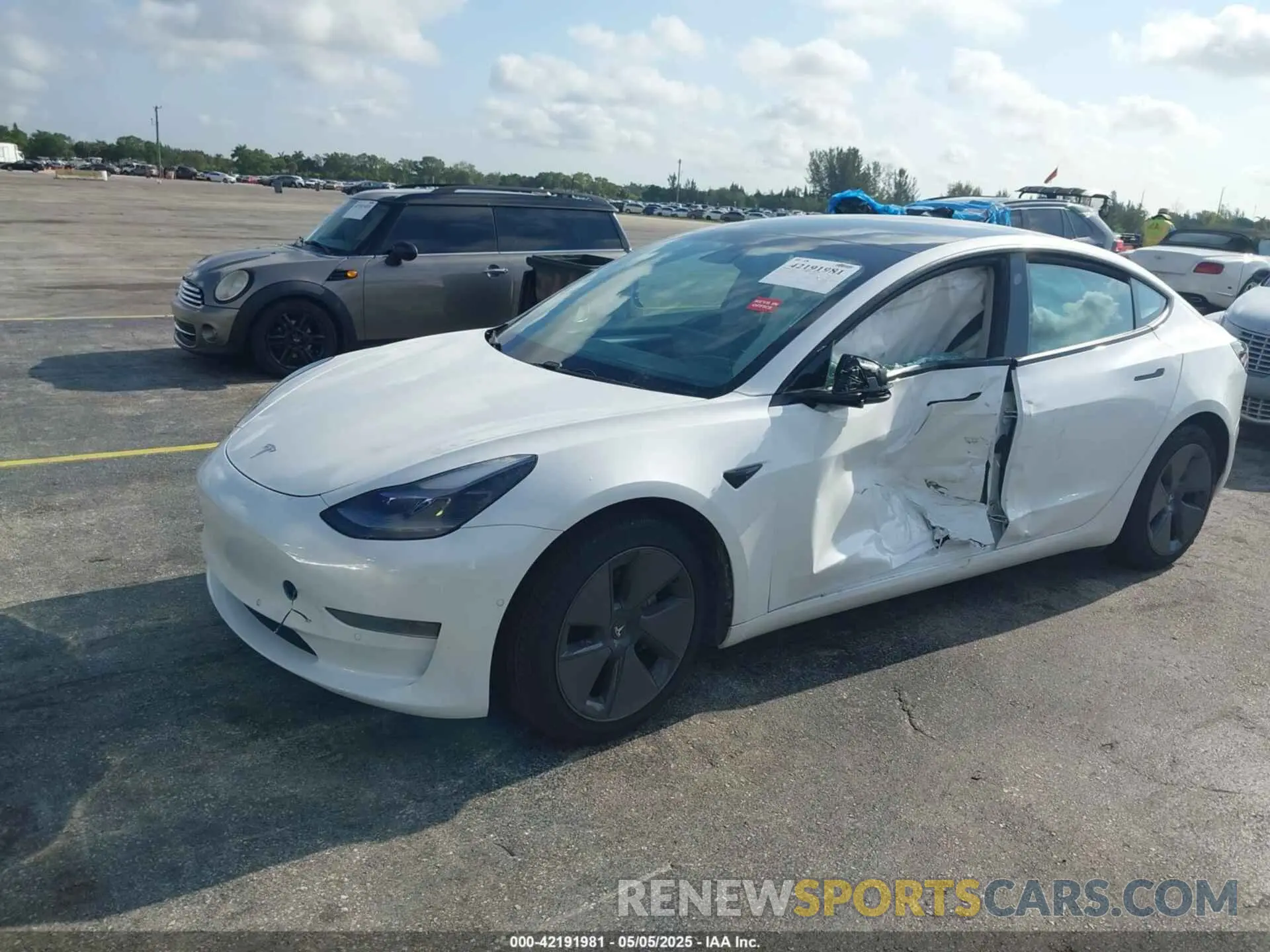 2 fotografías del automóvil dañado 5YJ3E1EA2MF973202 TESLA MODEL 3 2021