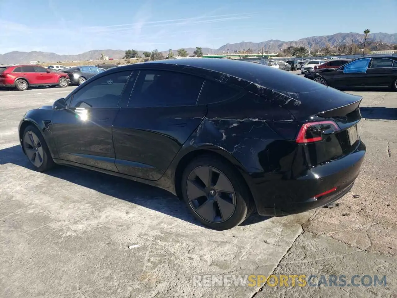 2 fotografías del automóvil dañado 5YJ3E1EA2MF997399 TESLA MODEL 3 2021