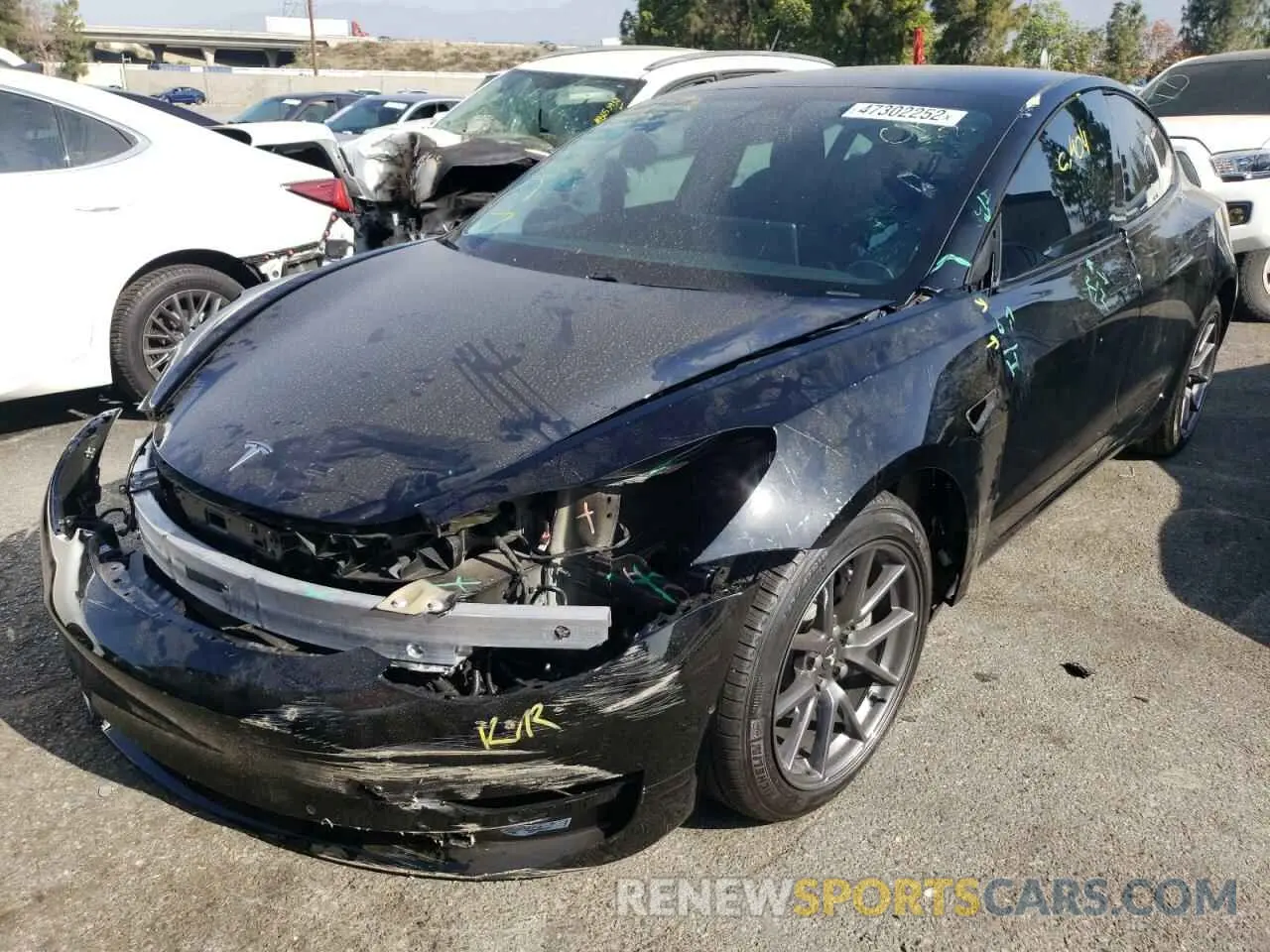 2 fotografías del automóvil dañado 5YJ3E1EA3MF022507 TESLA MODEL 3 2021
