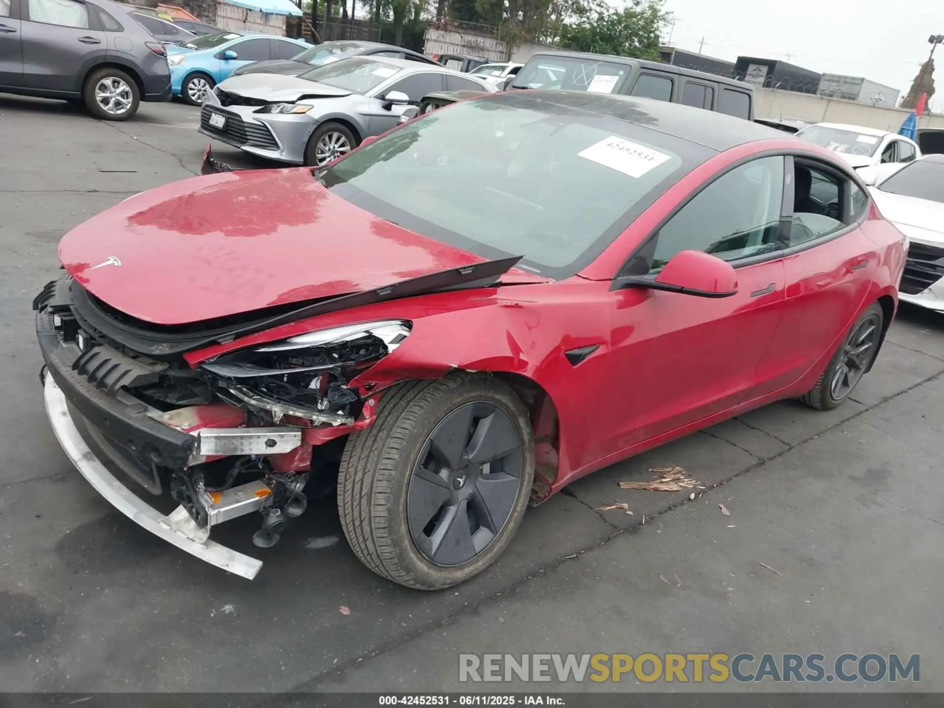 2 fotografías del automóvil dañado 5YJ3E1EA3MF994740 TESLA MODEL 3 2021