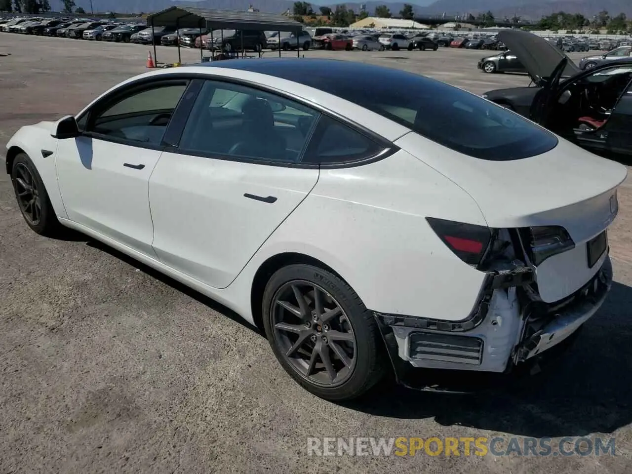 2 fotografías del automóvil dañado 5YJ3E1EA4MF976215 TESLA MODEL 3 2021