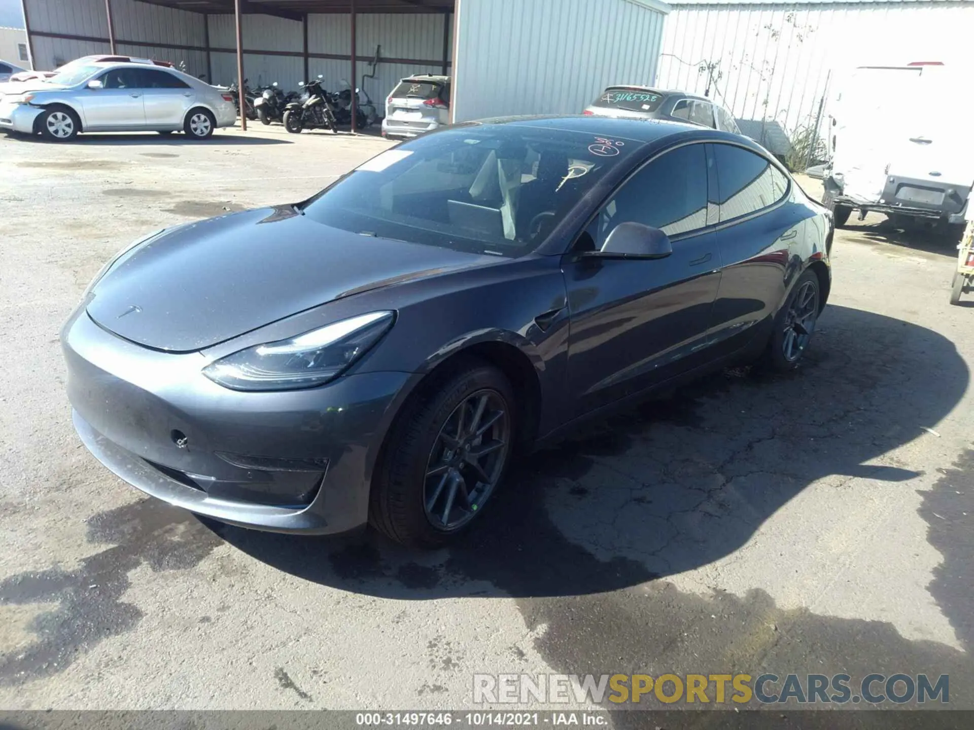 2 fotografías del automóvil dañado 5YJ3E1EA9MF873100 TESLA MODEL 3 2021