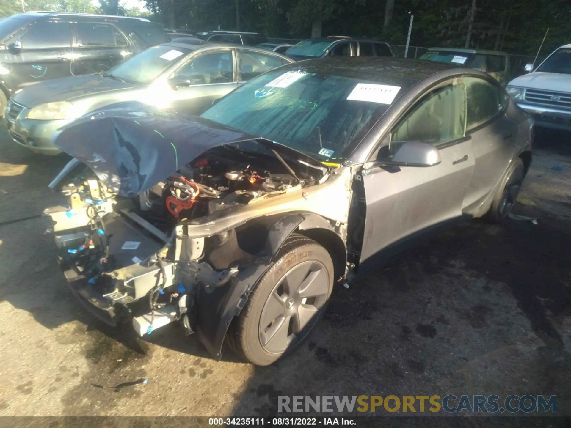 2 fotografías del automóvil dañado 5YJ3E1EB0MF853147 TESLA MODEL 3 2021