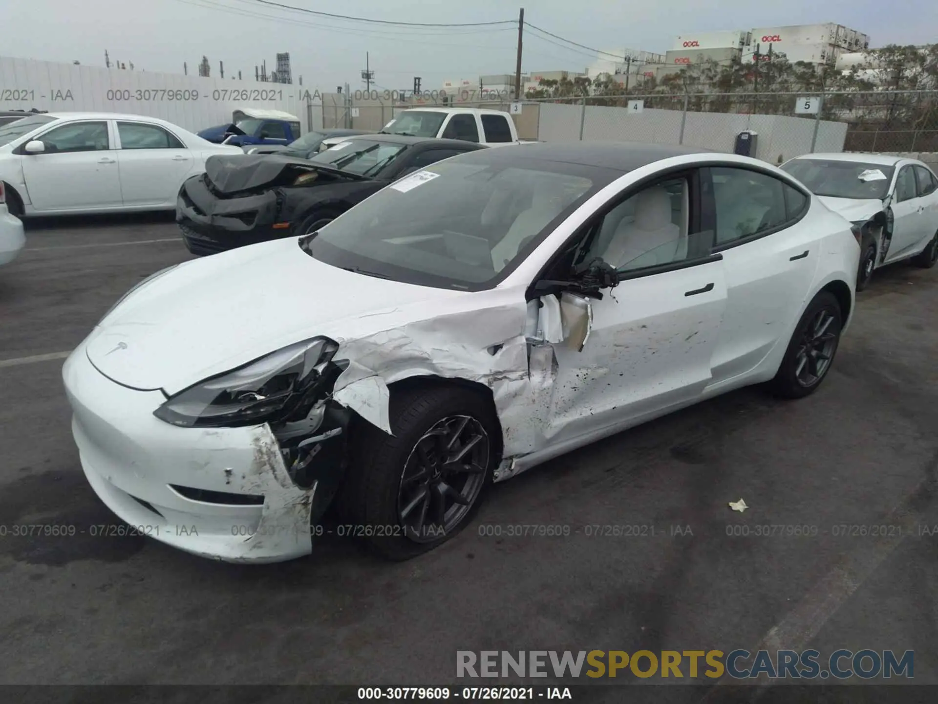 2 fotografías del automóvil dañado 5YJ3E1EB1MF001017 TESLA MODEL 3 2021