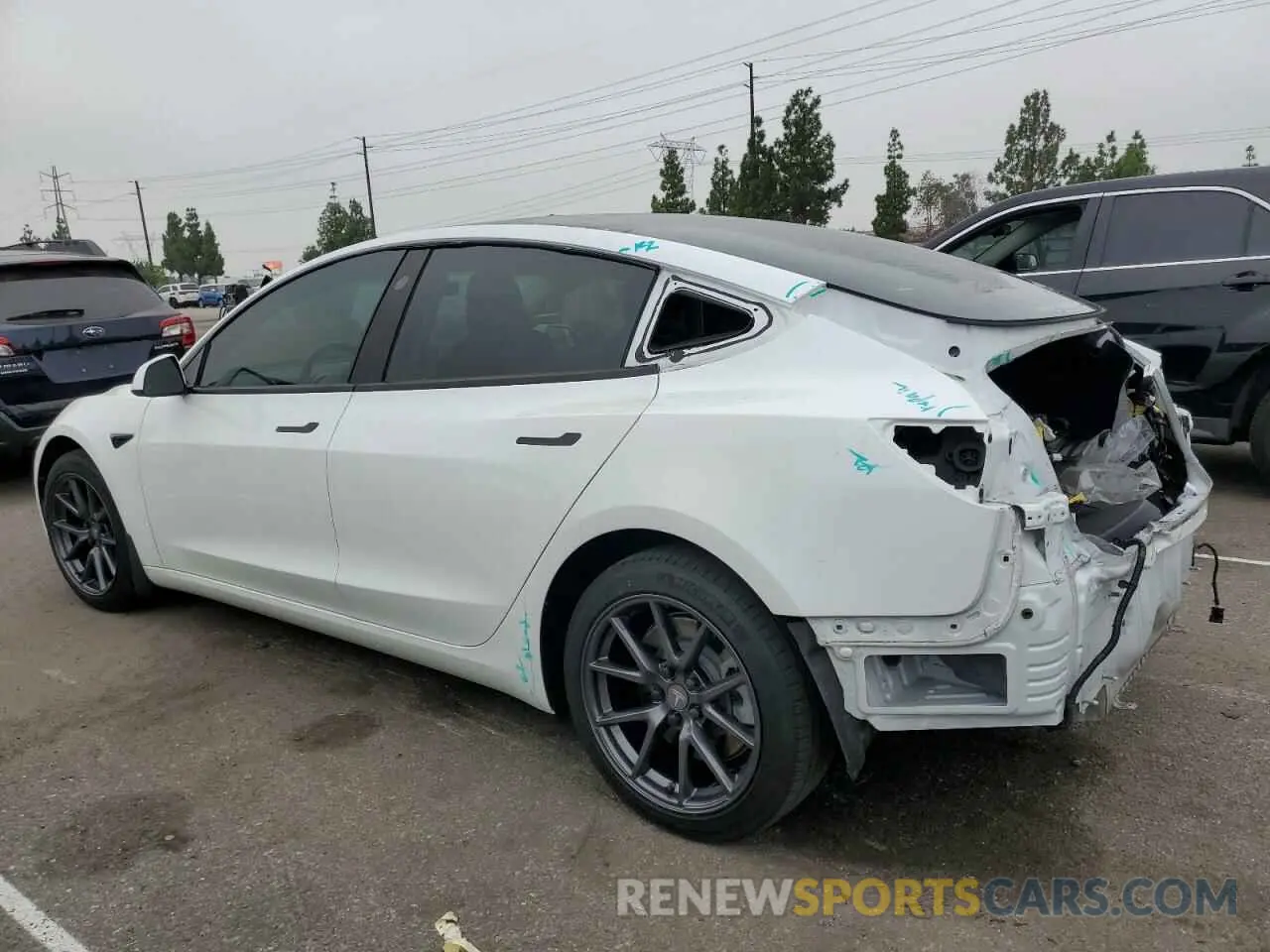 2 fotografías del automóvil dañado 5YJ3E1EB1MF928471 TESLA MODEL 3 2021