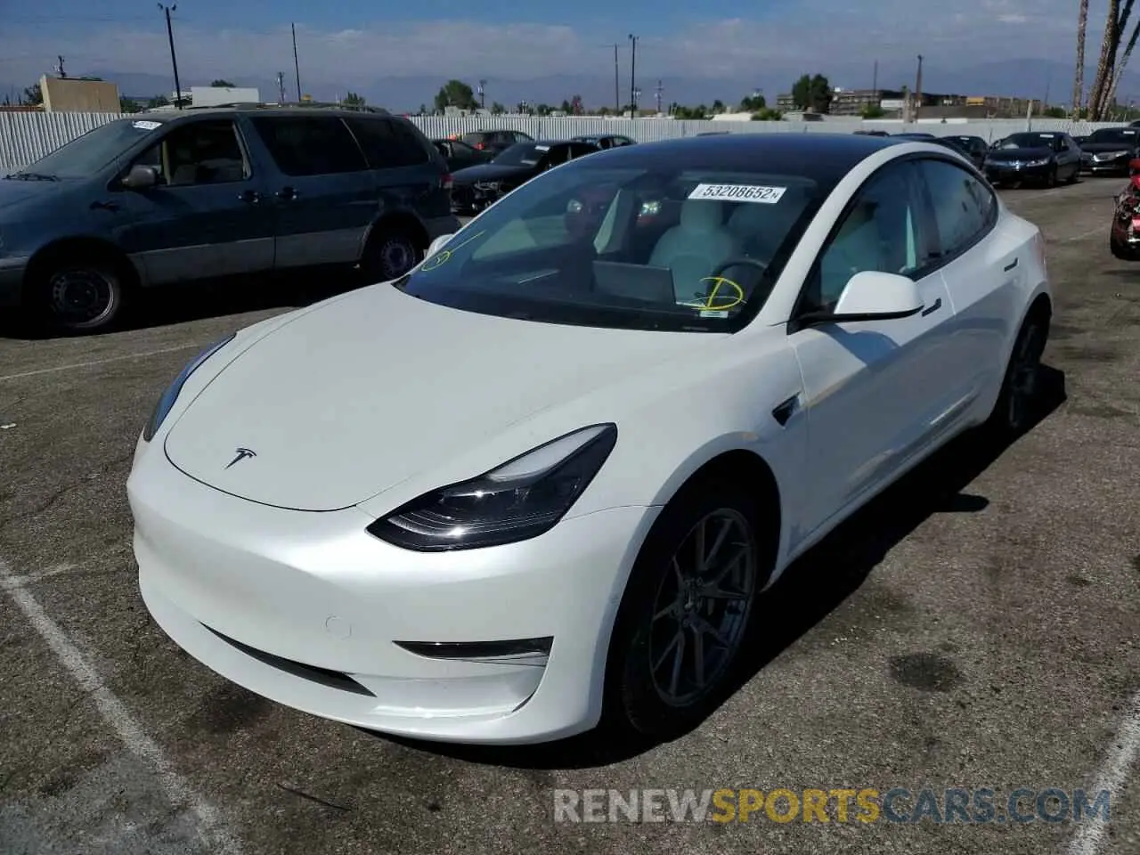 2 fotografías del automóvil dañado 5YJ3E1EC1MF077085 TESLA MODEL 3 2021
