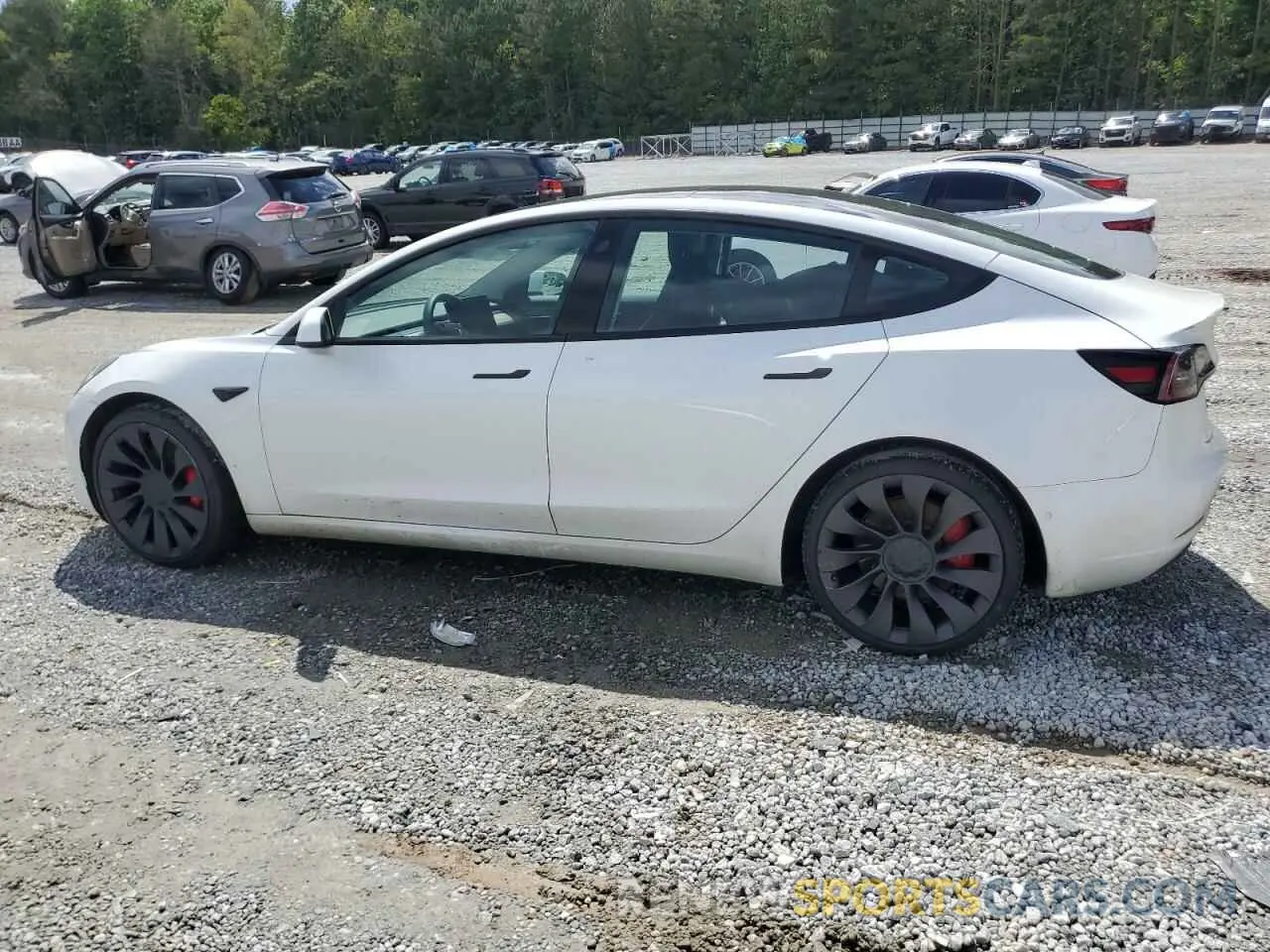 2 fotografías del automóvil dañado 5YJ3E1EC3MF030866 TESLA MODEL 3 2021