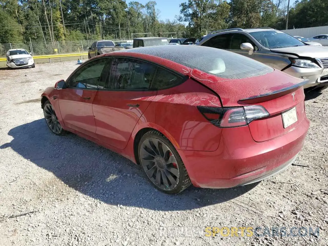 2 fotografías del automóvil dañado 5YJ3E1ECXMF049494 TESLA MODEL 3 2021