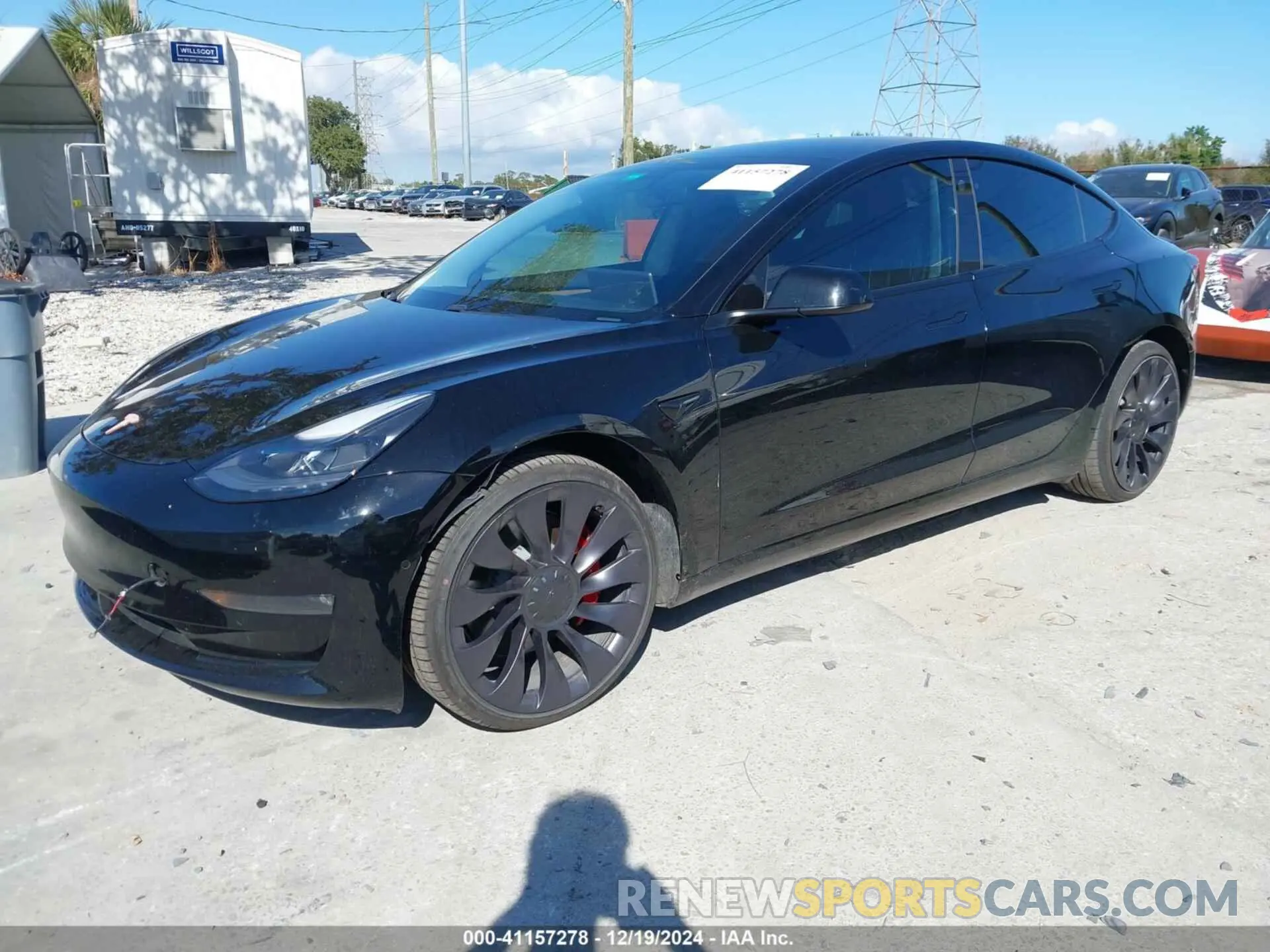 2 fotografías del automóvil dañado 5YJ3E1ECXMF991772 TESLA MODEL 3 2021