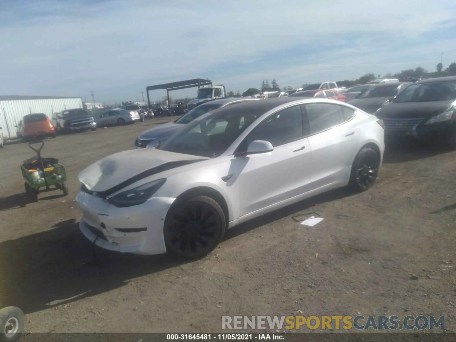 2 fotografías del automóvil dañado 5YJ3E1ECXMF996857 TESLA MODEL 3 2021