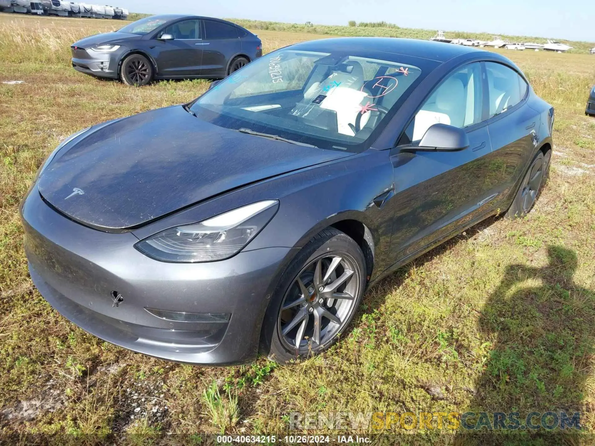 2 fotografías del automóvil dañado 5YJ3E1EA4NF201690 TESLA MODEL 3 2022