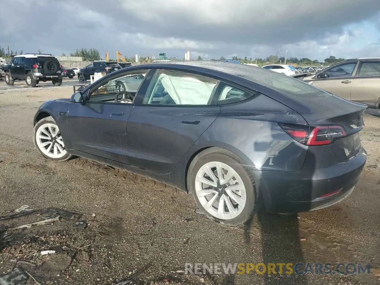 2 fotografías del automóvil dañado 5YJ3E1EA5NF331641 TESLA MODEL 3 2022