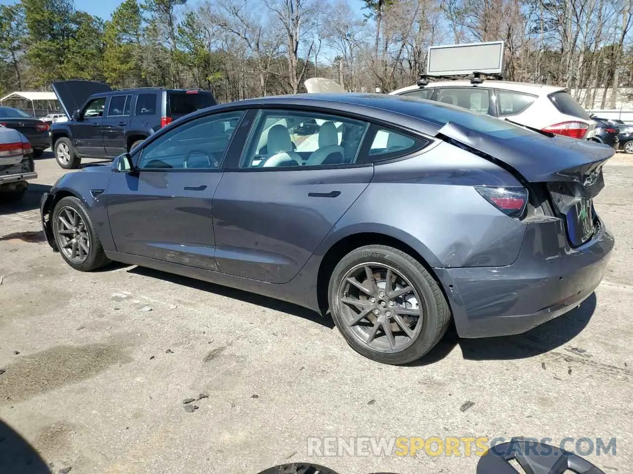 2 fotografías del automóvil dañado 5YJ3E1EA5NF339769 TESLA MODEL 3 2022