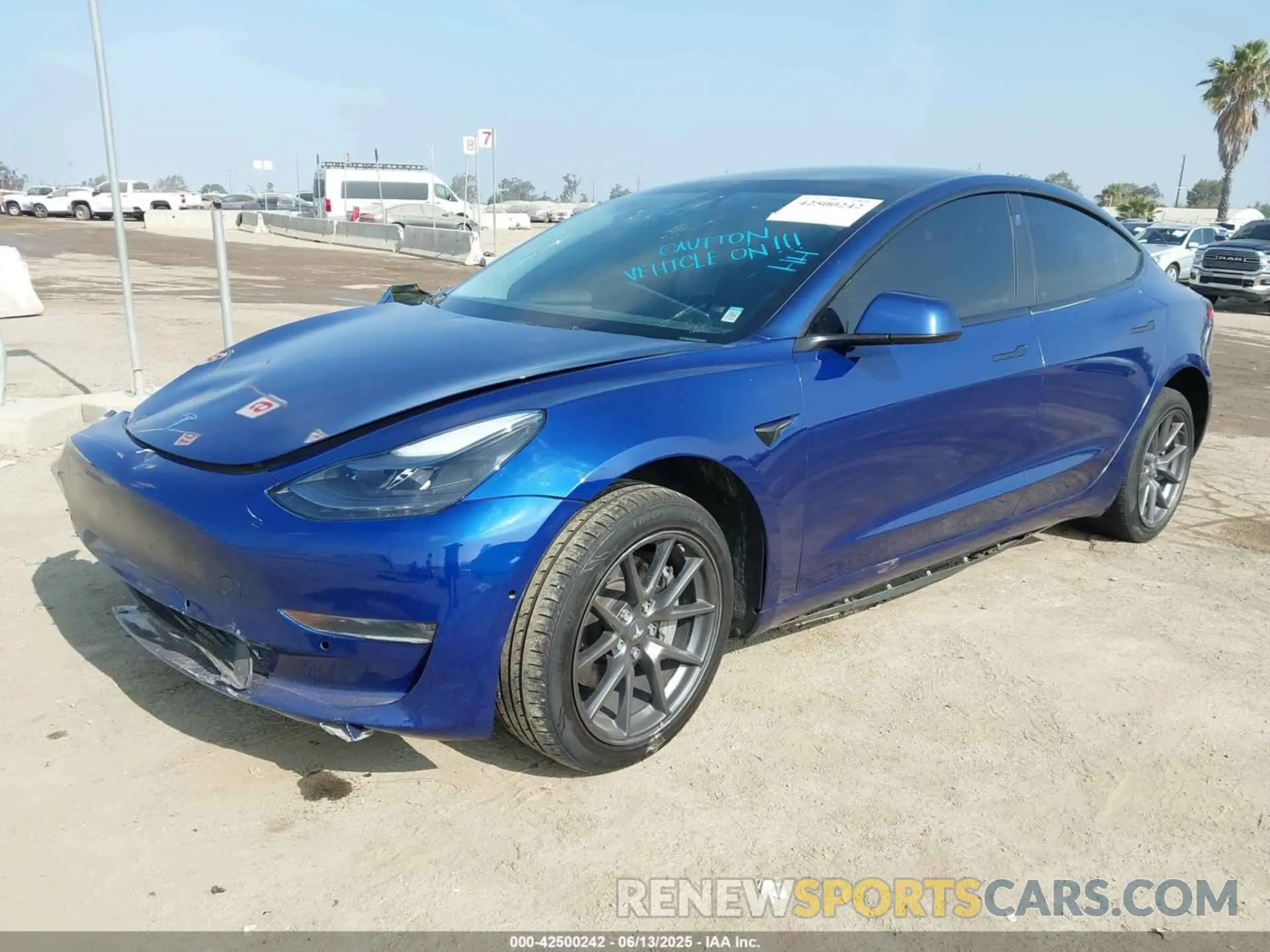 2 fotografías del automóvil dañado 5YJ3E1EB1NF189698 TESLA MODEL 3 2022