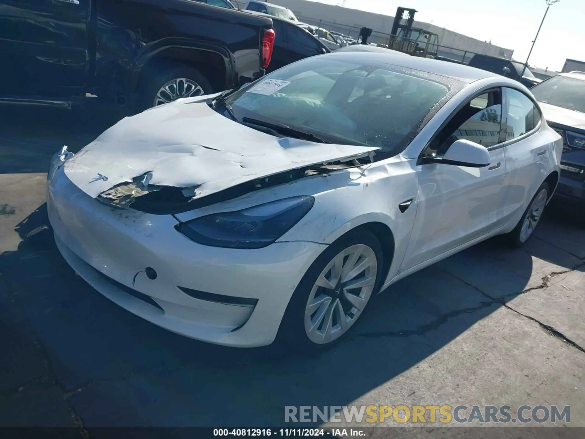 2 fotografías del automóvil dañado 5YJ3E1EB1NF298422 TESLA MODEL 3 2022