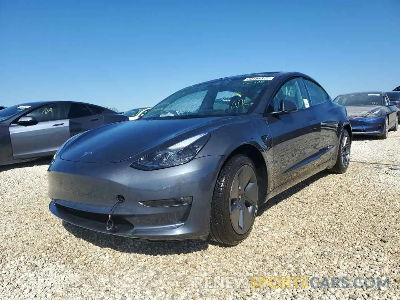 2 fotografías del automóvil dañado 5YJ3E1EB2NF104562 TESLA MODEL 3 2022