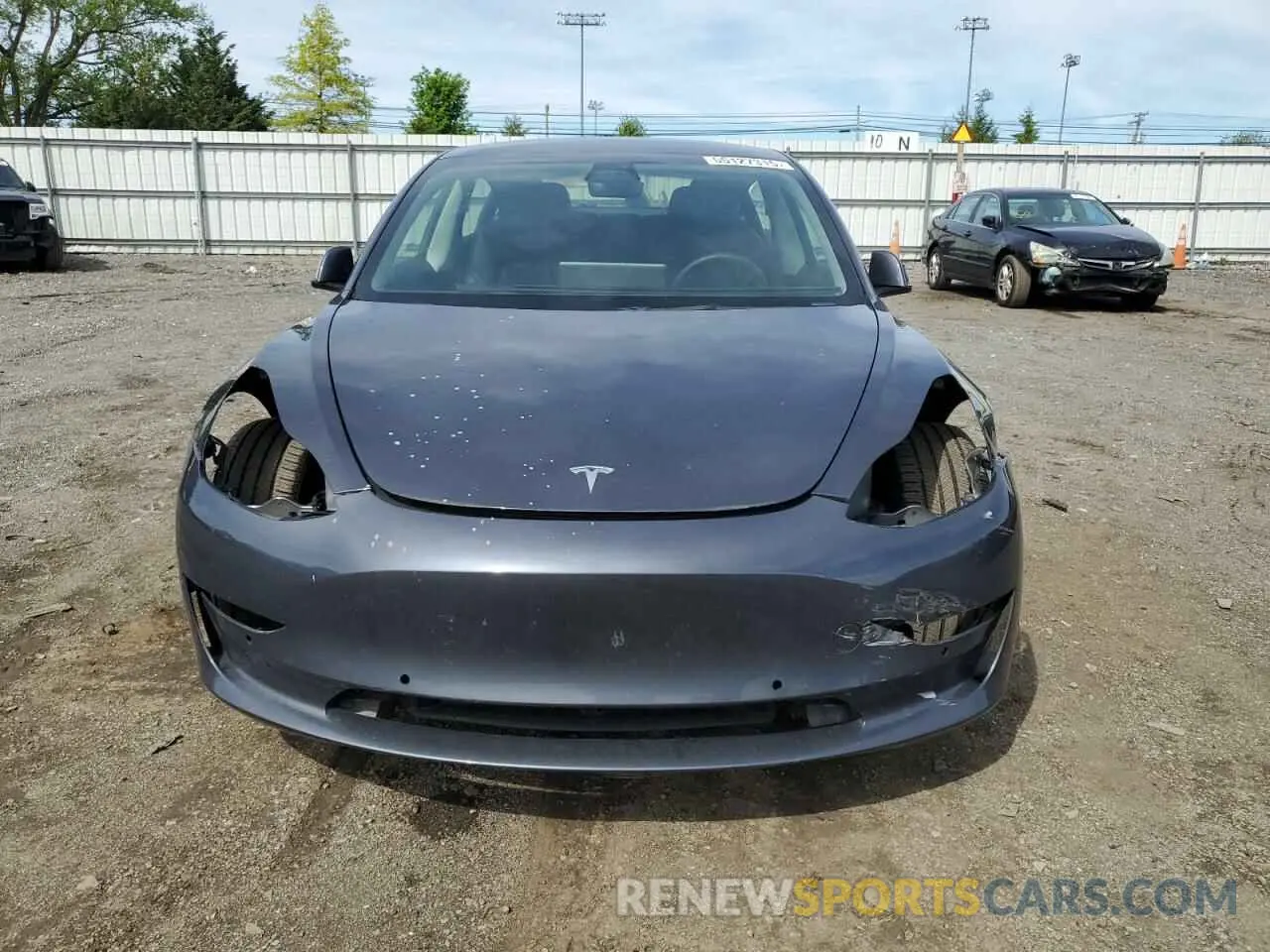 5 fotografías del automóvil dañado 5YJ3E1EB2NF111804 TESLA MODEL 3 2022
