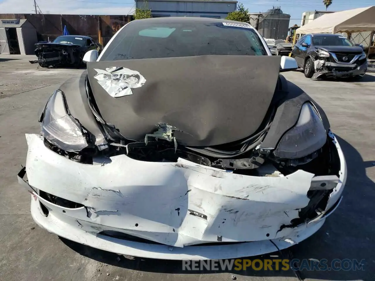 5 fotografías del automóvil dañado 5YJ3E1EB3NF143581 TESLA MODEL 3 2022
