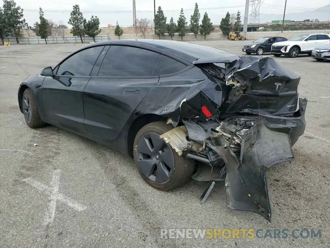 2 fotografías del automóvil dañado 5YJ3E1EB3NF257774 TESLA MODEL 3 2022