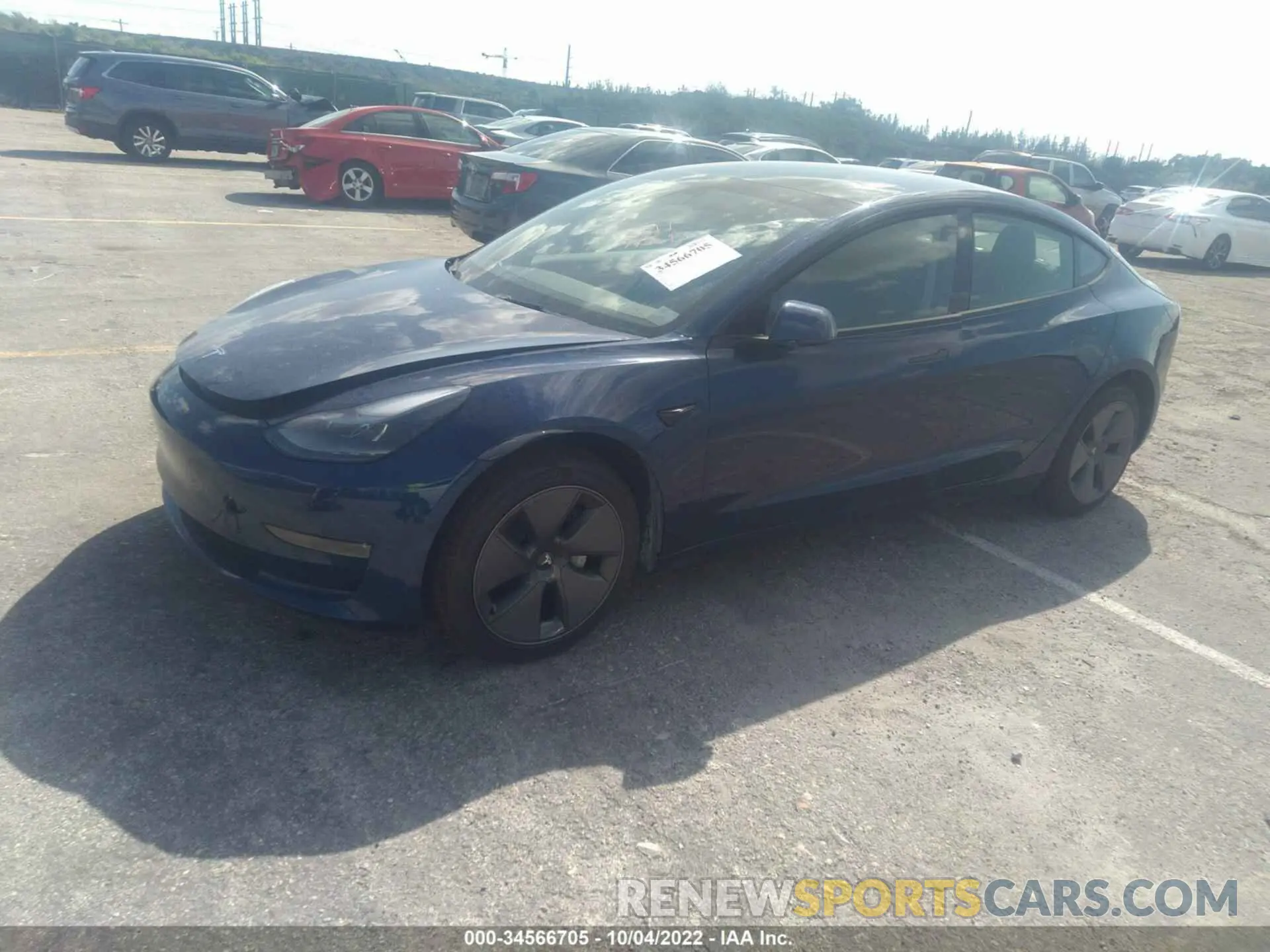 2 fotografías del automóvil dañado 5YJ3E1EB4NF103056 TESLA MODEL 3 2022