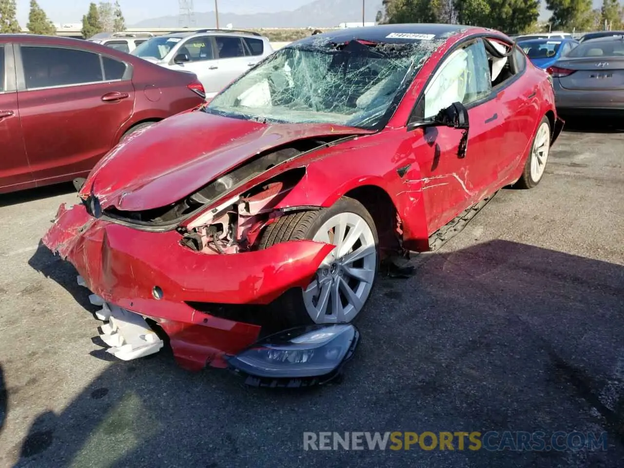 2 fotografías del automóvil dañado 5YJ3E1EB4NF145002 TESLA MODEL 3 2022