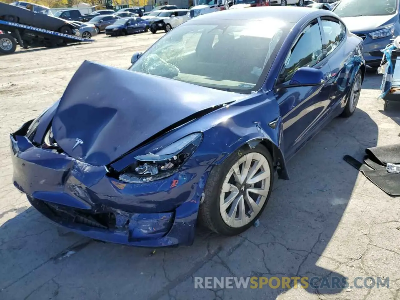 2 fotografías del automóvil dañado 5YJ3E1EB4NF185631 TESLA MODEL 3 2022