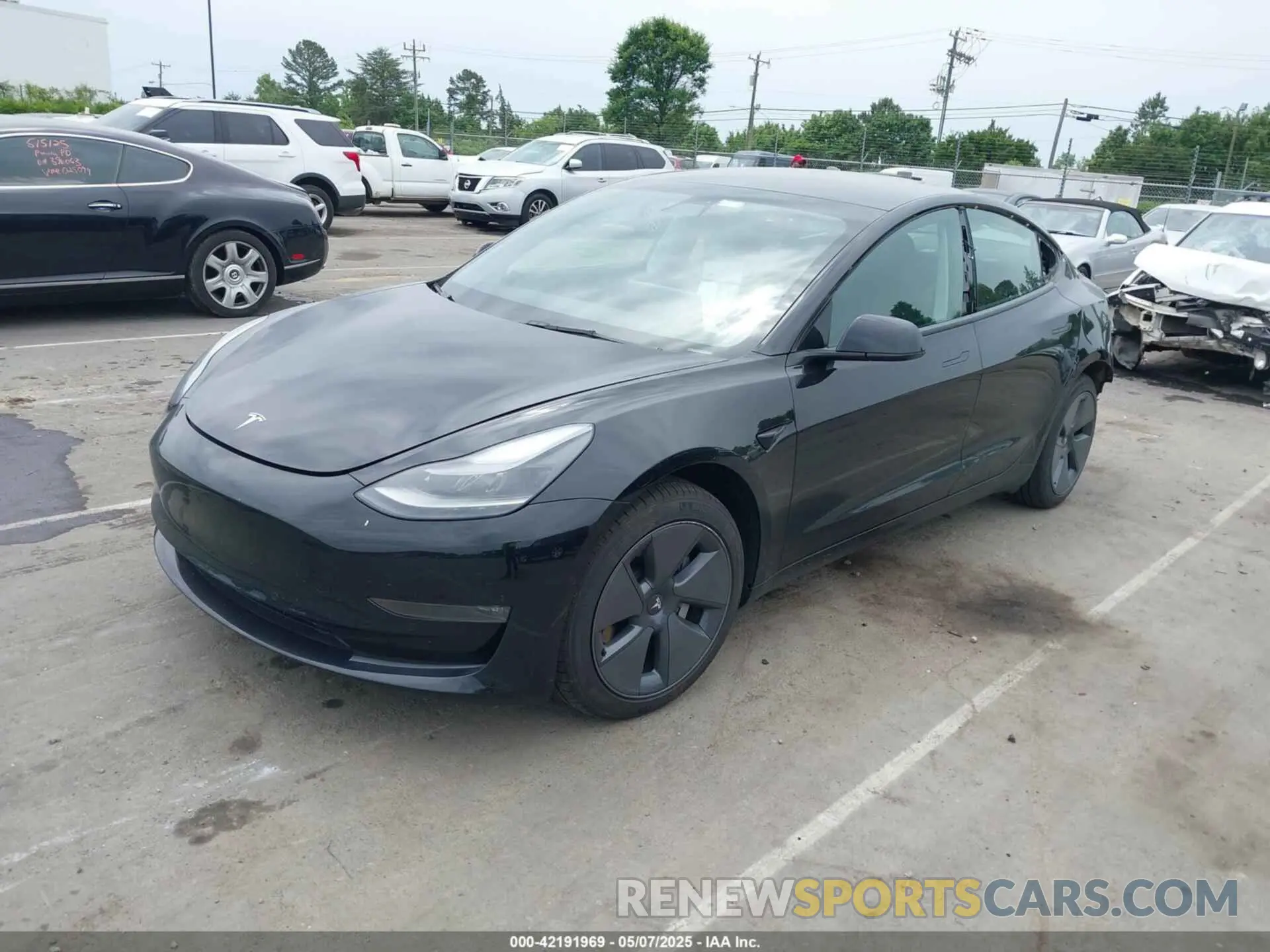 2 fotografías del automóvil dañado 5YJ3E1EB5NF117192 TESLA MODEL 3 2022