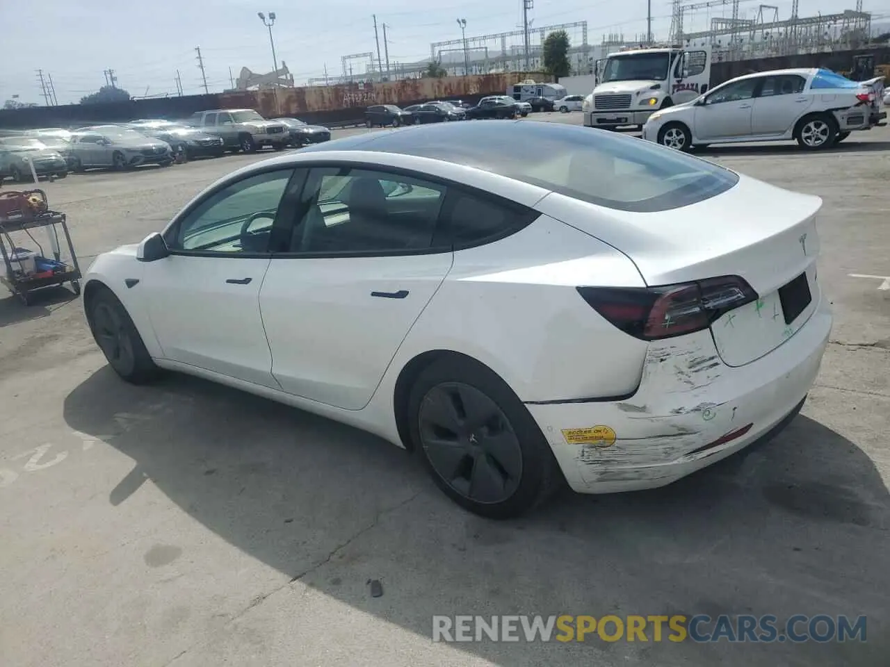 2 fotografías del automóvil dañado 5YJ3E1EB5NF184262 TESLA MODEL 3 2022