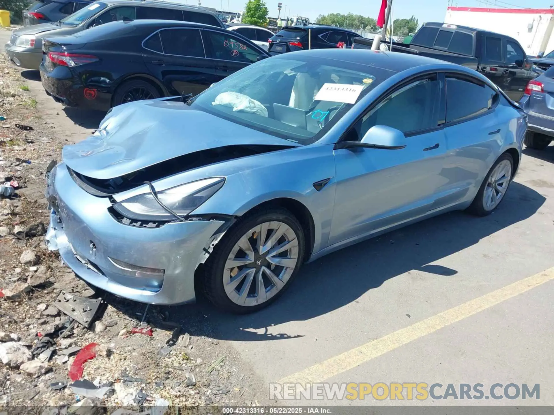 2 fotografías del automóvil dañado 5YJ3E1EB5NF270106 TESLA MODEL 3 2022