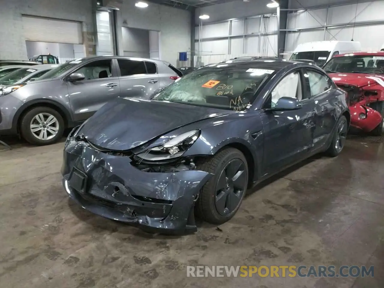 2 fotografías del automóvil dañado 5YJ3E1EB8NF185468 TESLA MODEL 3 2022
