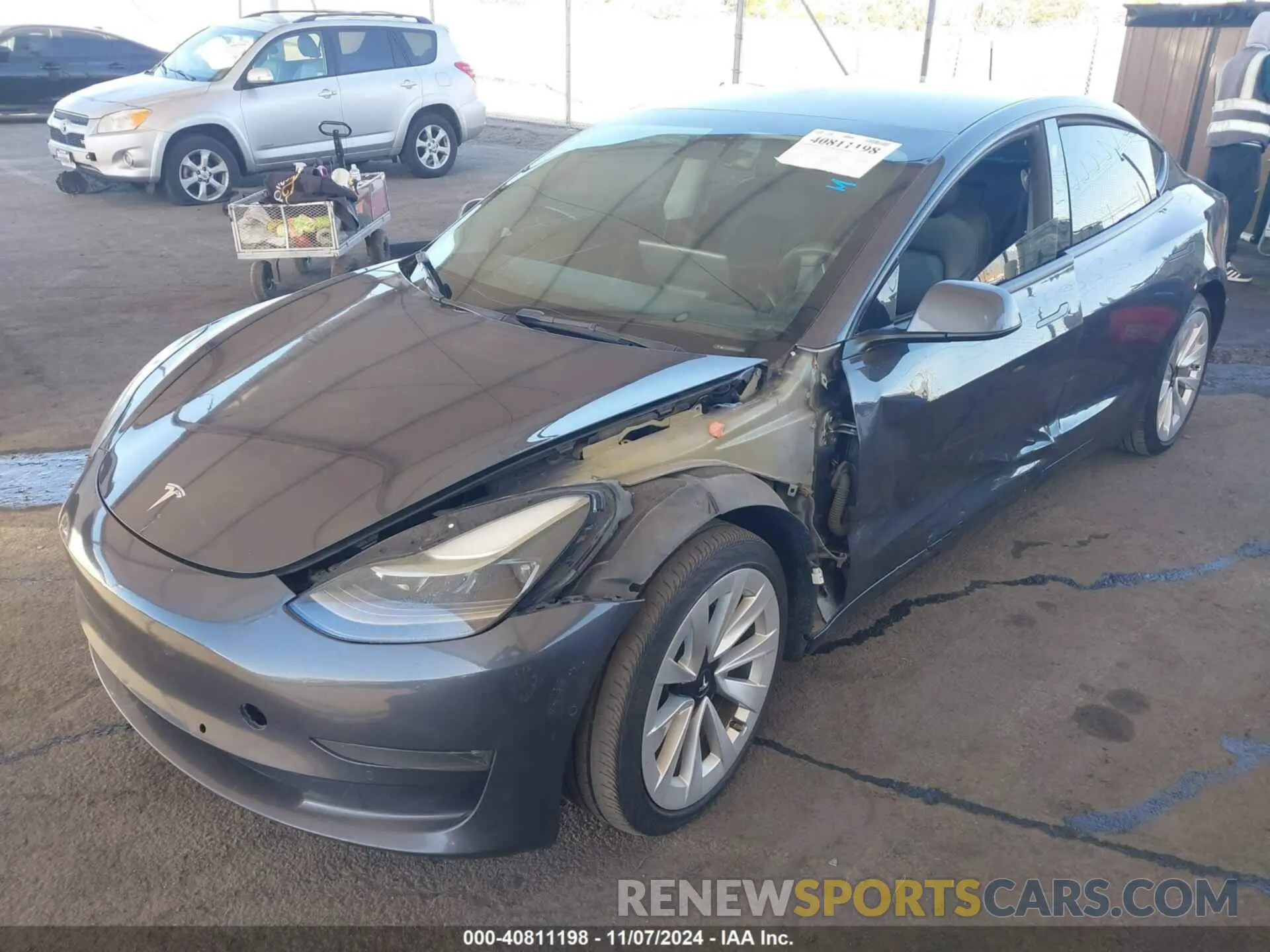 2 fotografías del automóvil dañado 5YJ3E1EBXNF124073 TESLA MODEL 3 2022