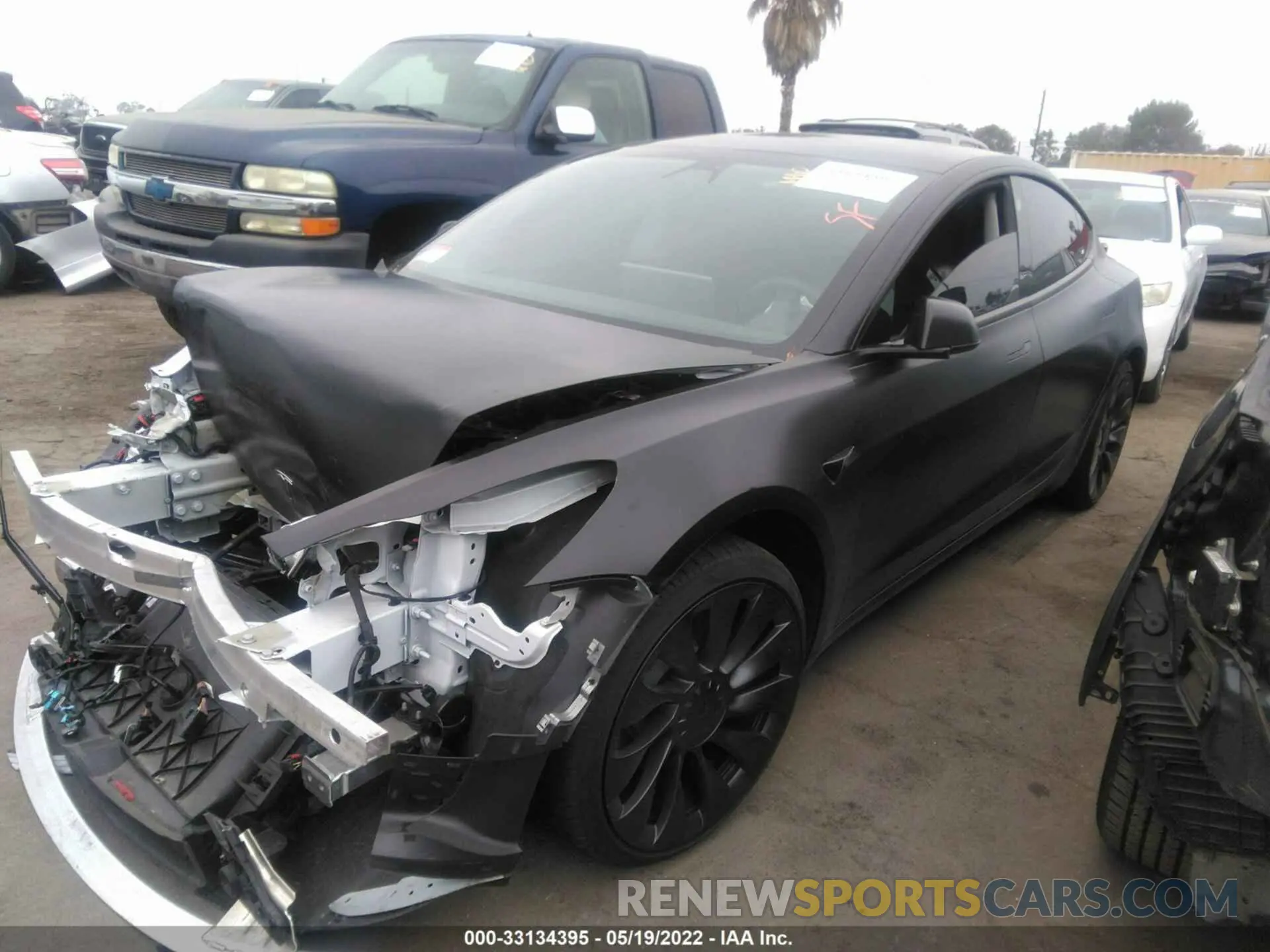 2 fotografías del automóvil dañado 5YJ3E1EC5NF113300 TESLA MODEL 3 2022