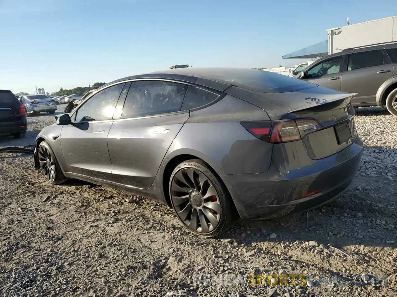 2 fotografías del automóvil dañado 5YJ3E1ECXNF129640 TESLA MODEL 3 2022