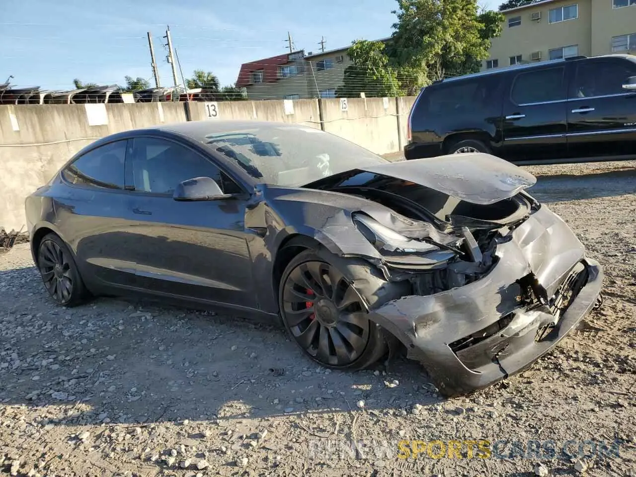 4 fotografías del automóvil dañado 5YJ3E1ECXNF129640 TESLA MODEL 3 2022