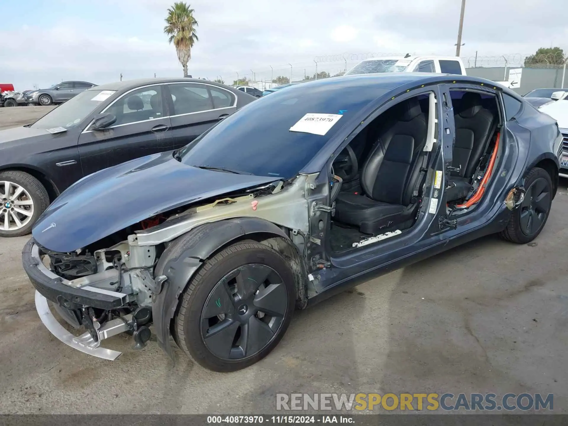 2 fotografías del automóvil dañado 5YJ3E1EA1PF489915 TESLA MODEL 3 2023