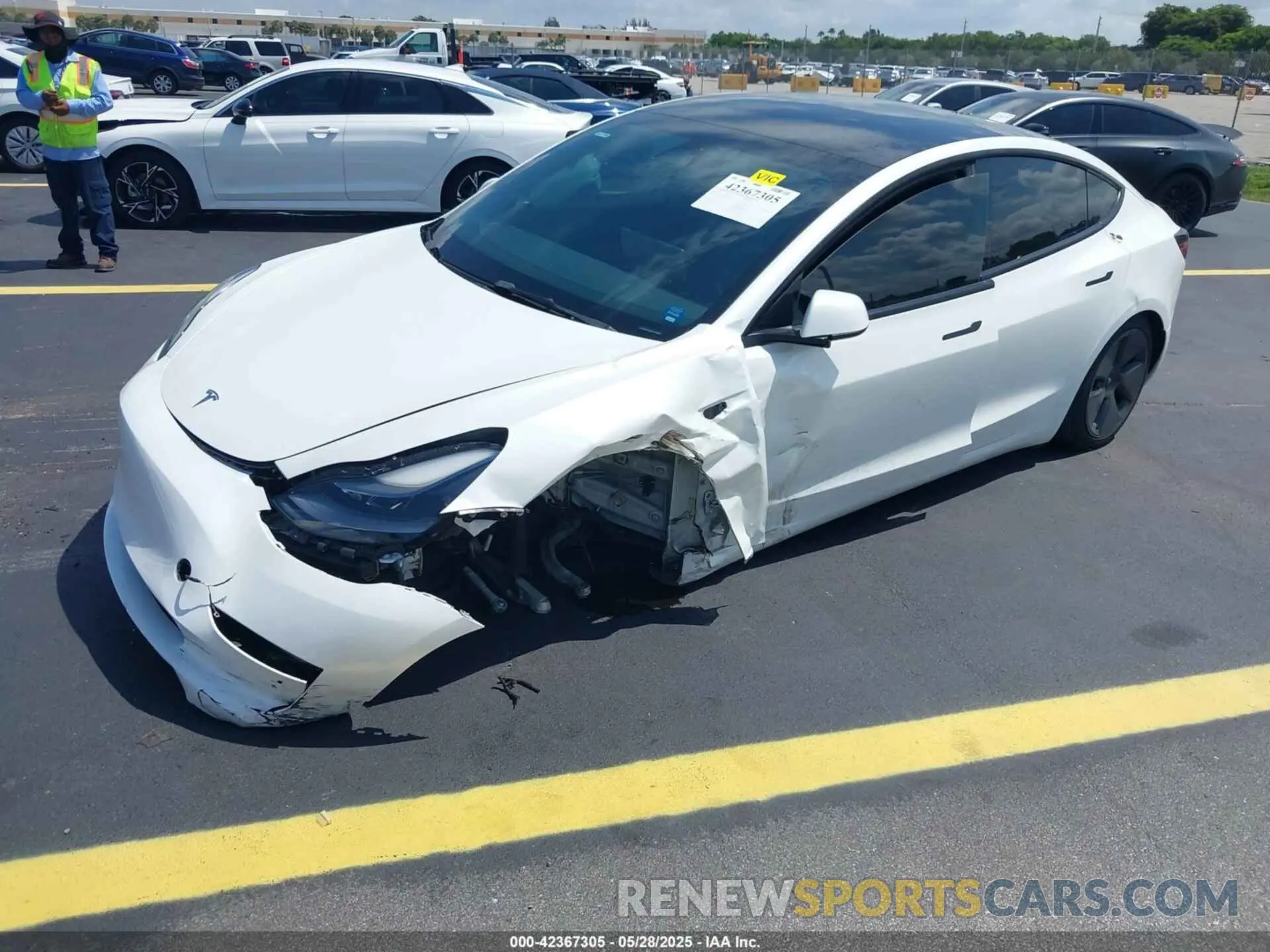2 fotografías del automóvil dañado 5YJ3E1EA3PF489477 TESLA MODEL 3 2023