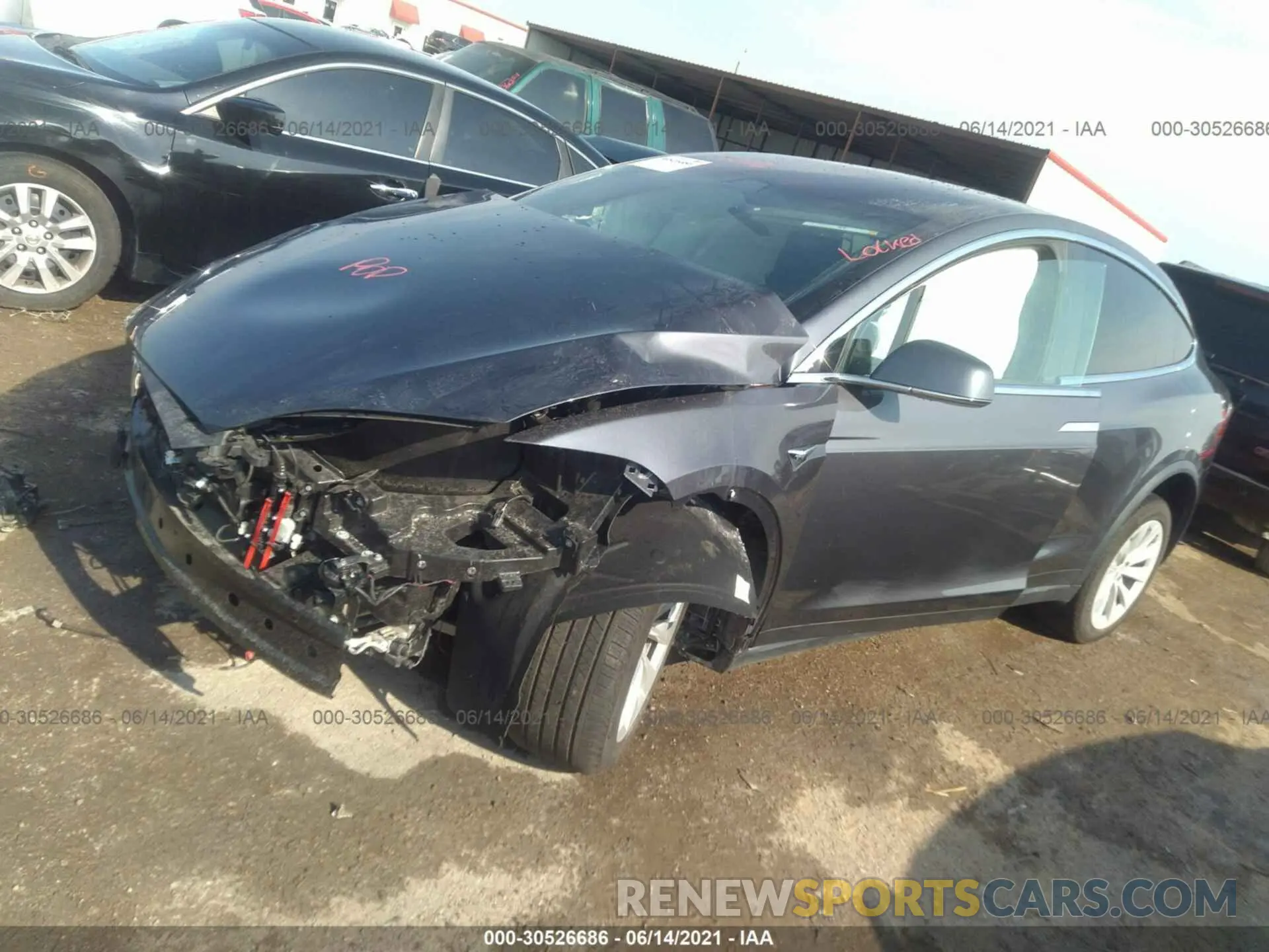 2 fotografías del automóvil dañado 5YJXCAE20LF302819 TESLA MODEL X 2020