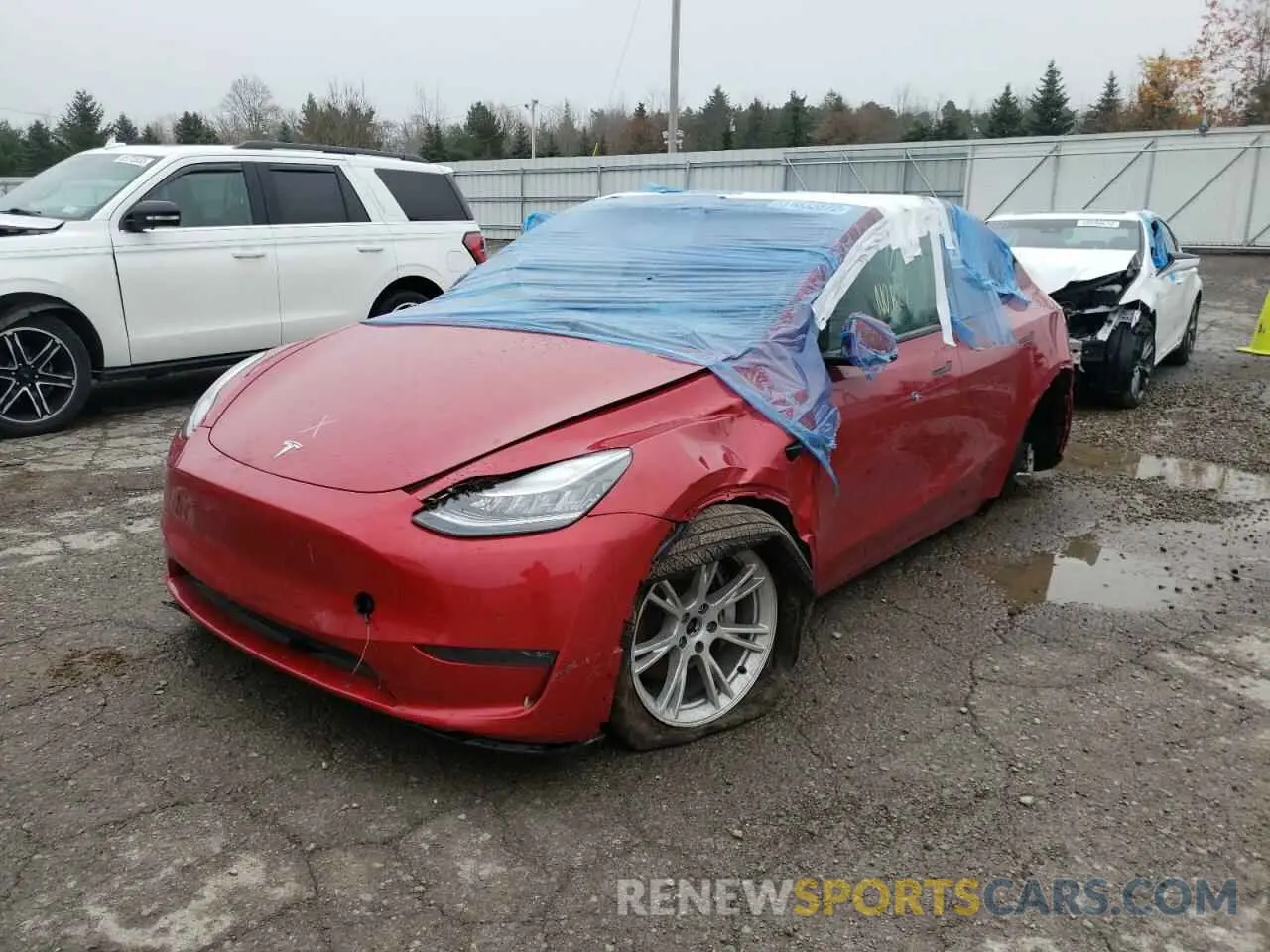 2 fotografías del automóvil dañado 5YJYGDEE4LF014743 TESLA MODEL Y 2020