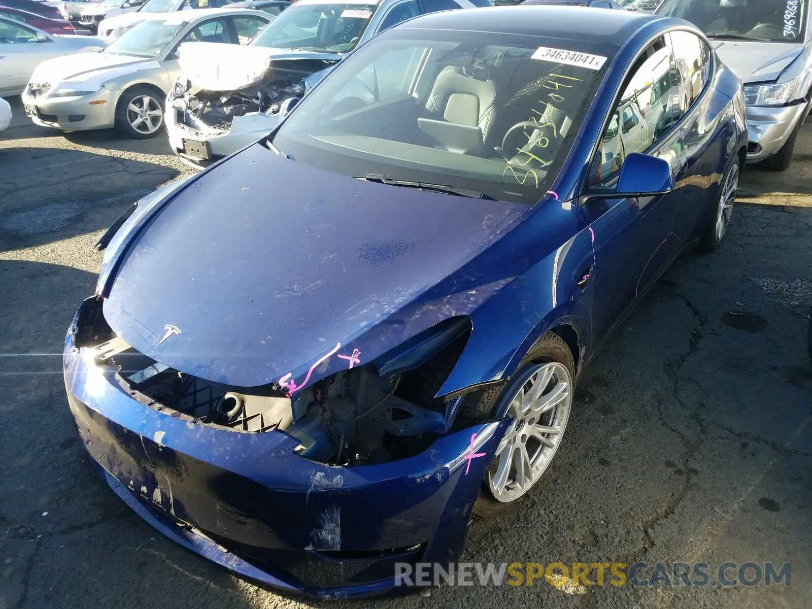 2 fotografías del automóvil dañado 5YJYGDEE4LF059049 TESLA MODEL Y 2020