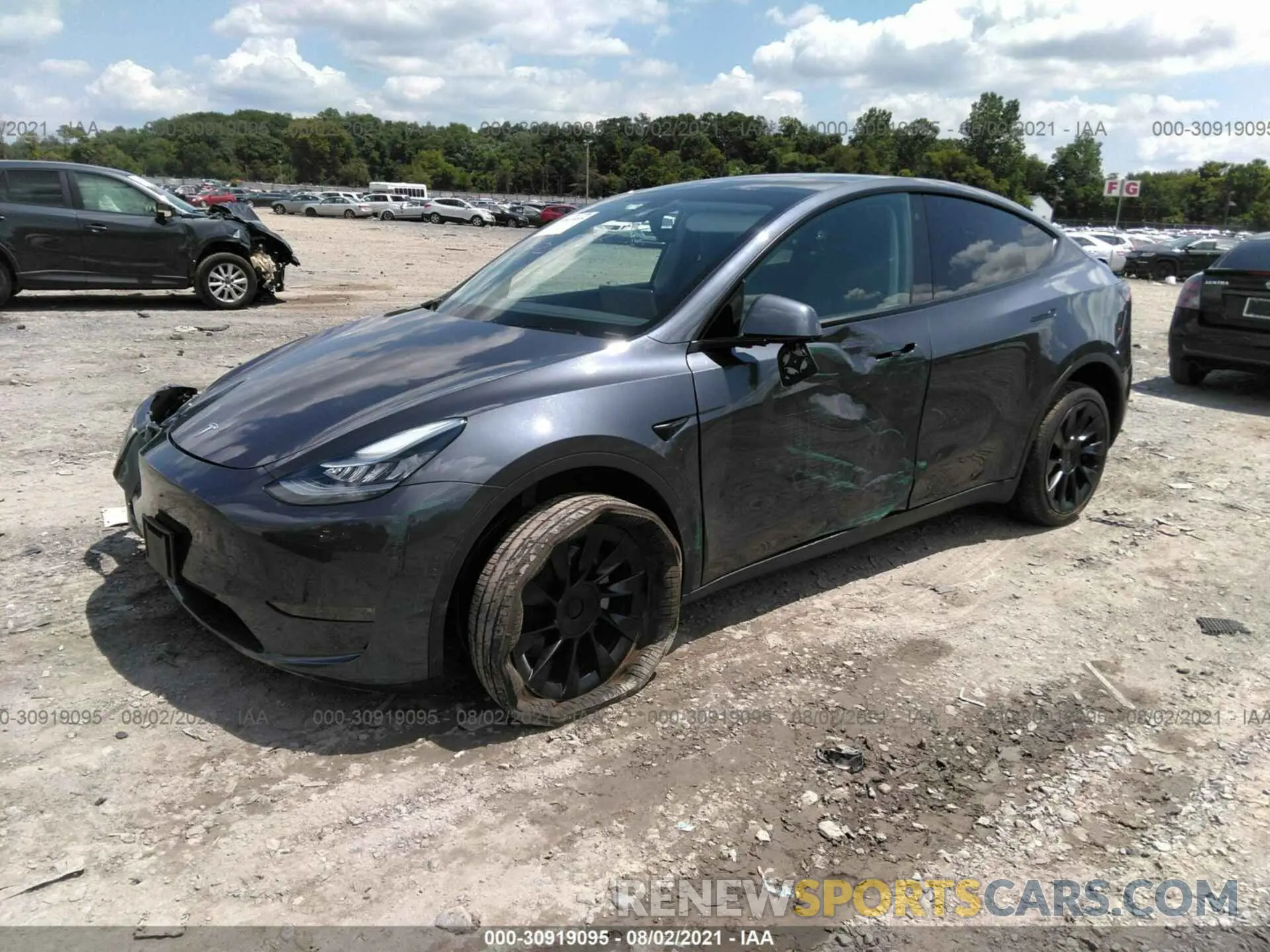 2 fotografías del automóvil dañado 5YJYGDEE5LF048562 TESLA MODEL Y 2020