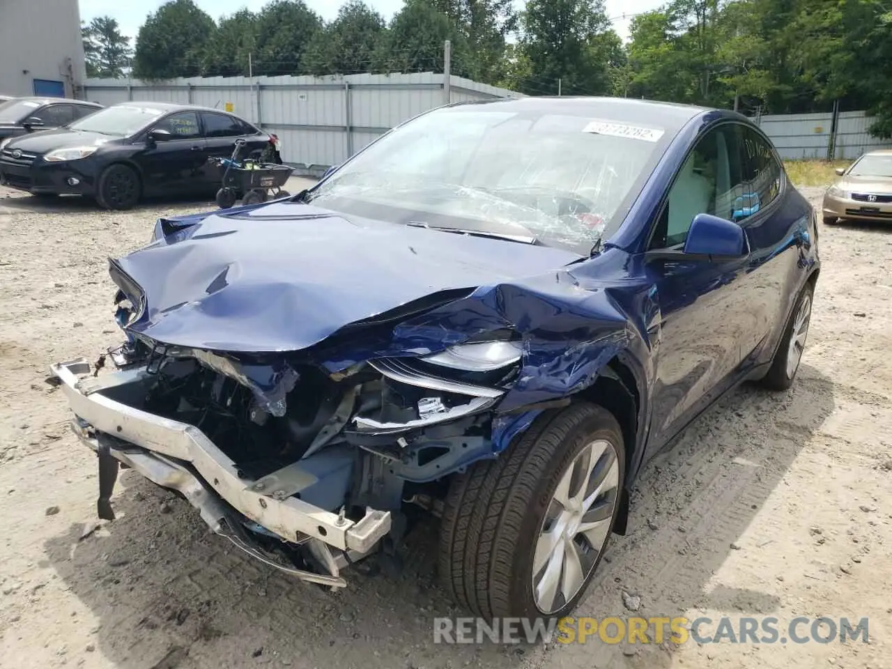 2 fotografías del automóvil dañado 5YJYGDEE8LF031139 TESLA MODEL Y 2020