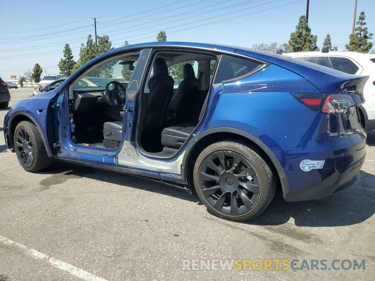 2 fotografías del automóvil dañado 5YJYGAEE3MF223021 TESLA MODEL Y 2021