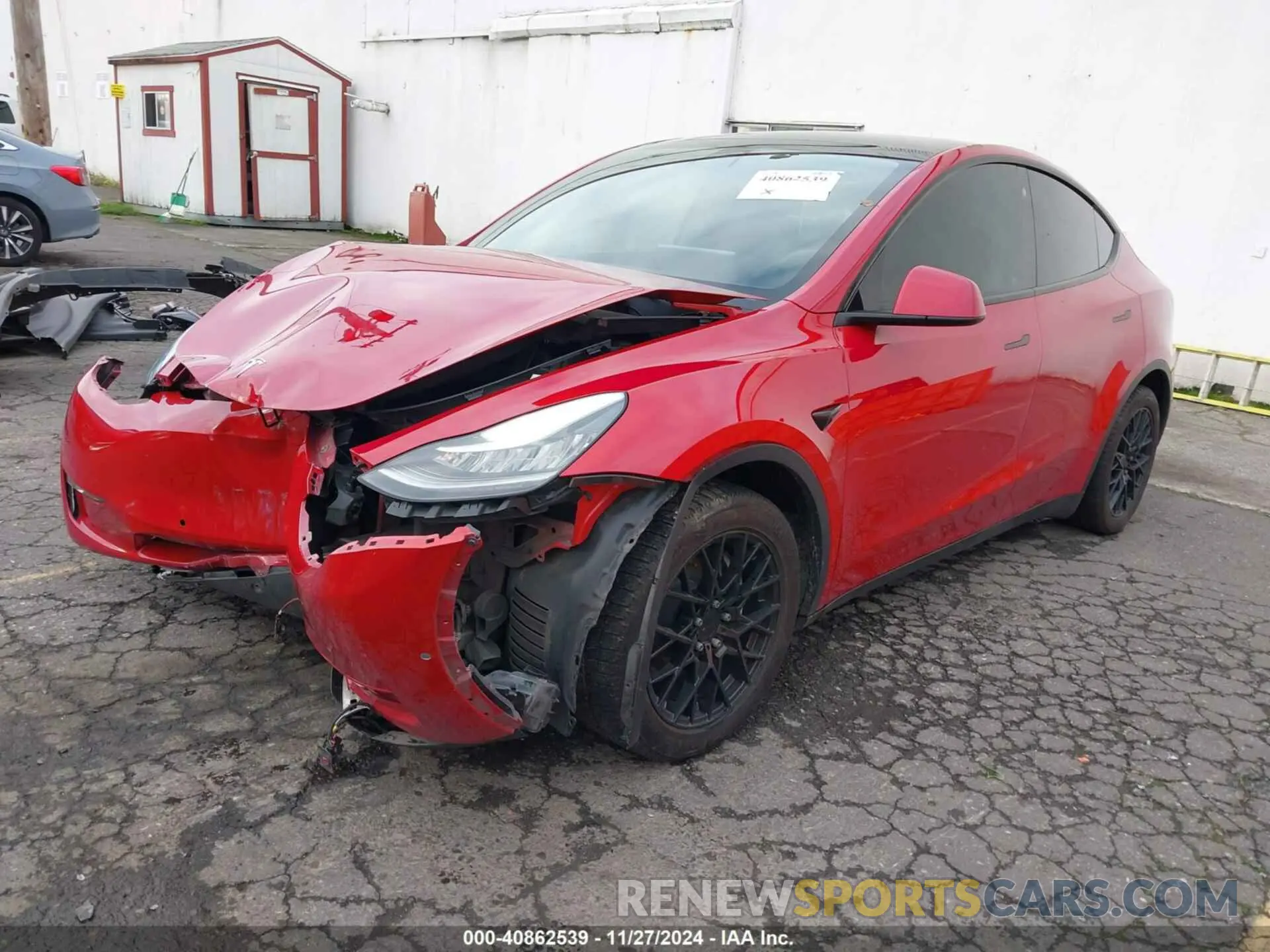 2 fotografías del automóvil dañado 5YJYGAEE4MF200475 TESLA MODEL Y 2021
