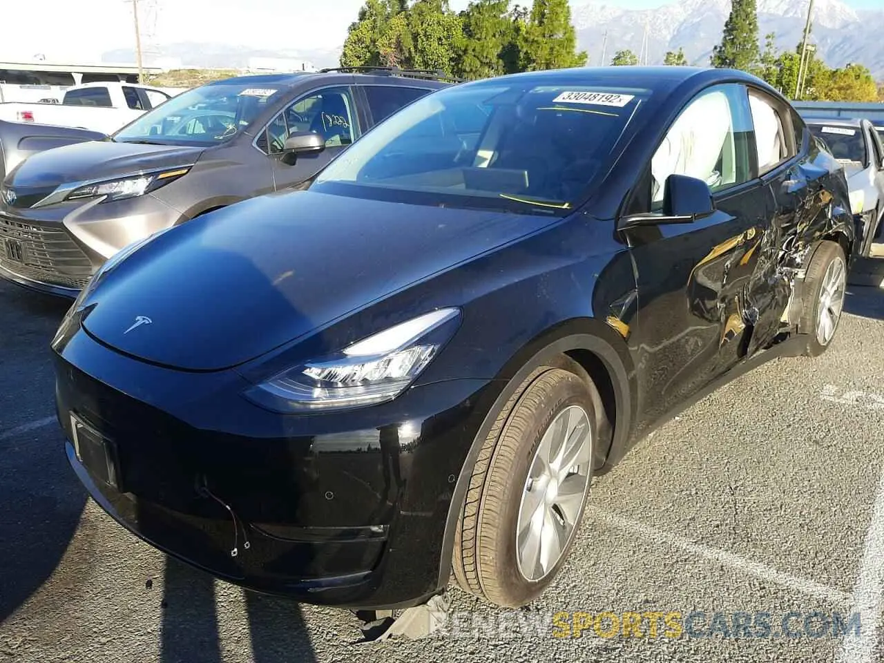 2 fotografías del automóvil dañado 5YJYGAEE5MF295614 TESLA MODEL Y 2021