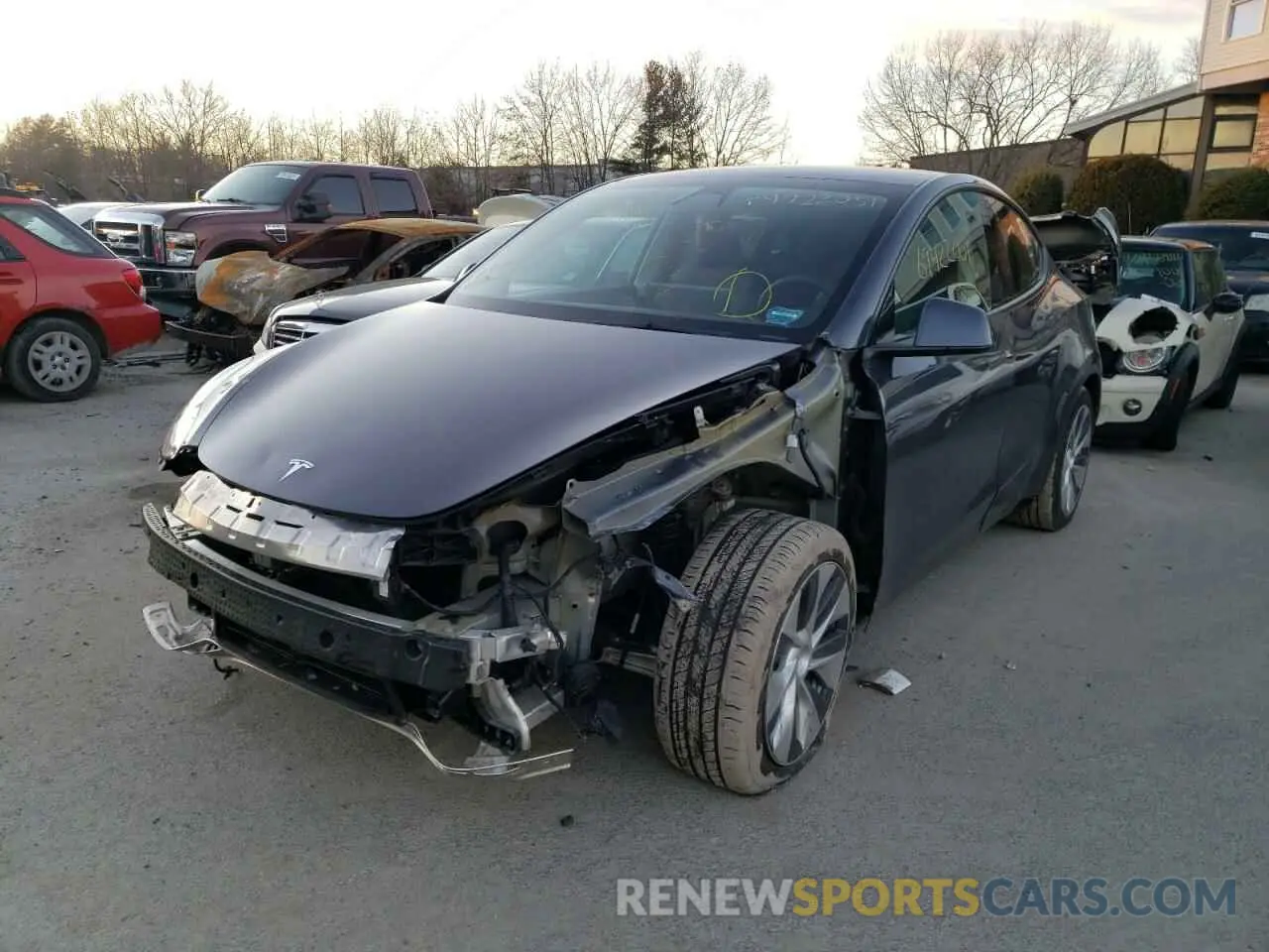 2 fotografías del automóvil dañado 5YJYGAEE8MF116305 TESLA MODEL Y 2021