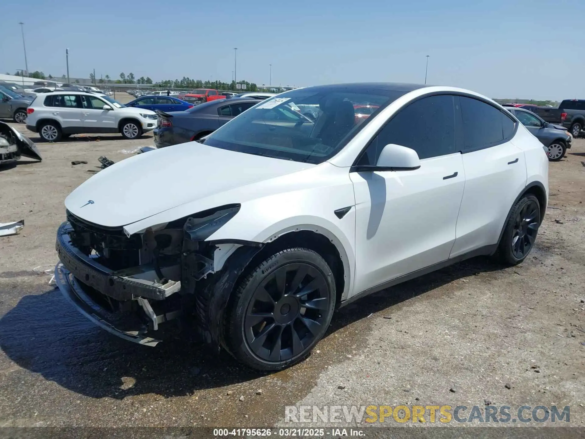 2 fotografías del automóvil dañado 5YJYGAEE8MF187987 TESLA MODEL Y 2021