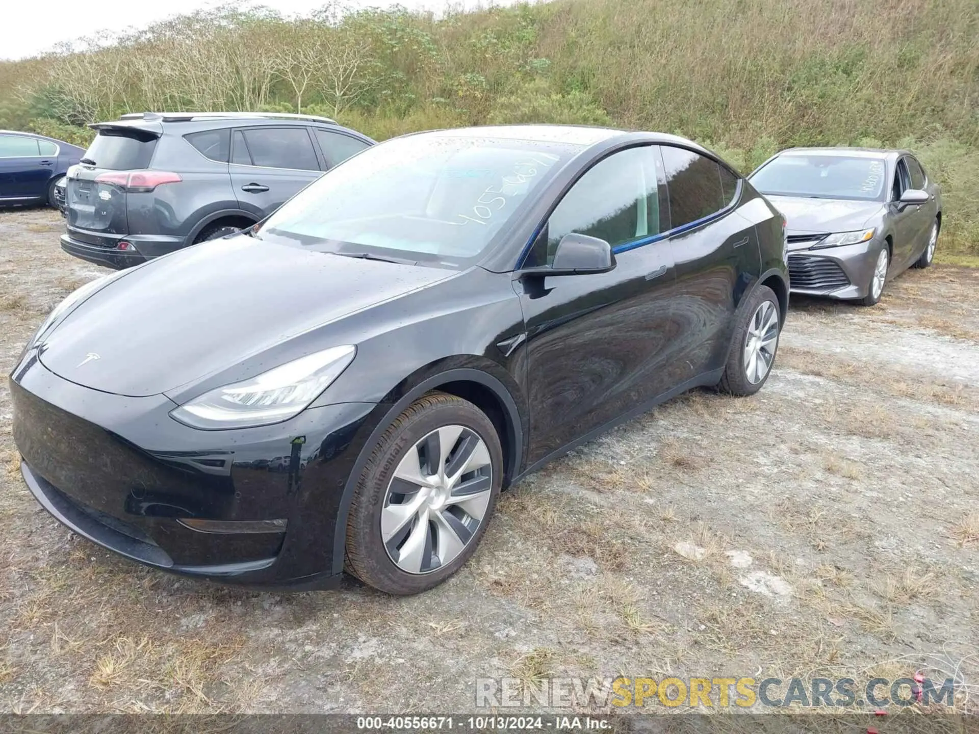 2 fotografías del automóvil dañado 5YJYGAEEXMF188106 TESLA MODEL Y 2021