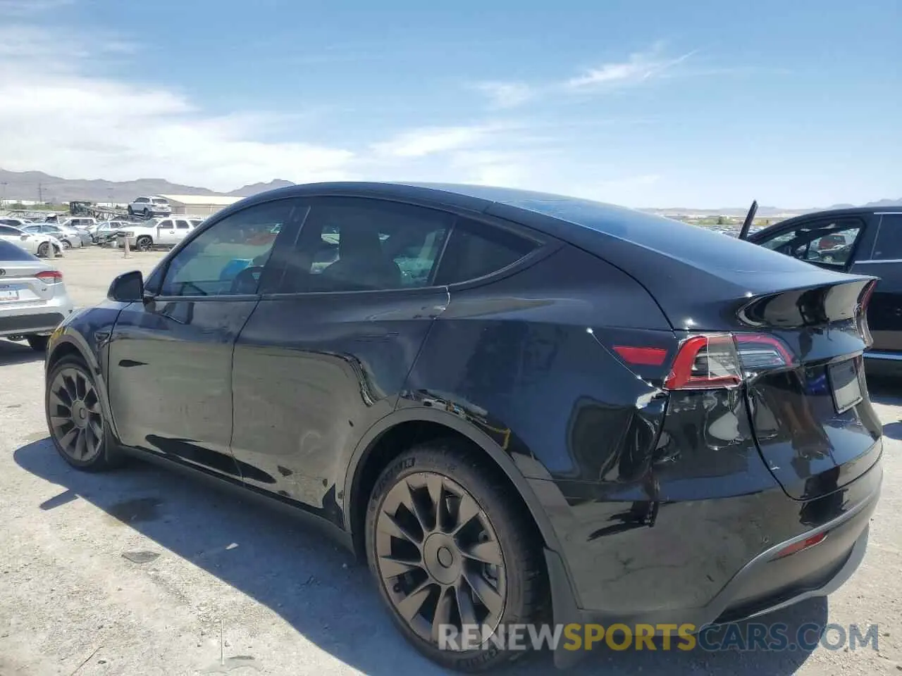 2 fotografías del automóvil dañado 5YJYGAEEXMF304033 TESLA MODEL Y 2021